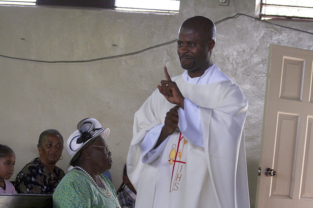 Jamaica. Father carl clark preaching at sunday mass in the catholic church at seaford town