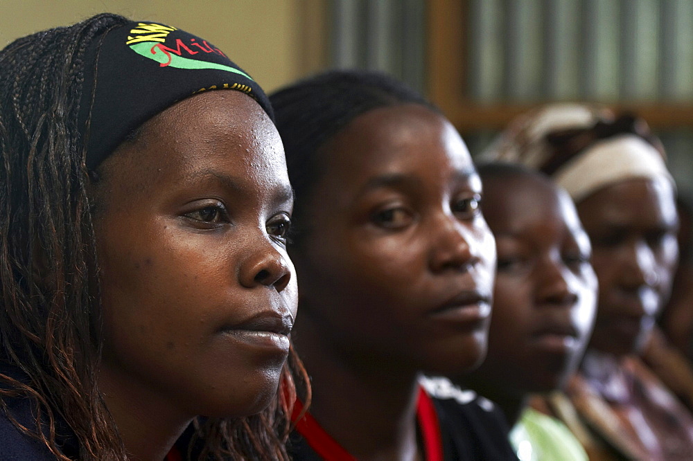 Kenya. Faces of the congregation at catholic mass in mukuru ruben, a slum of nairobi