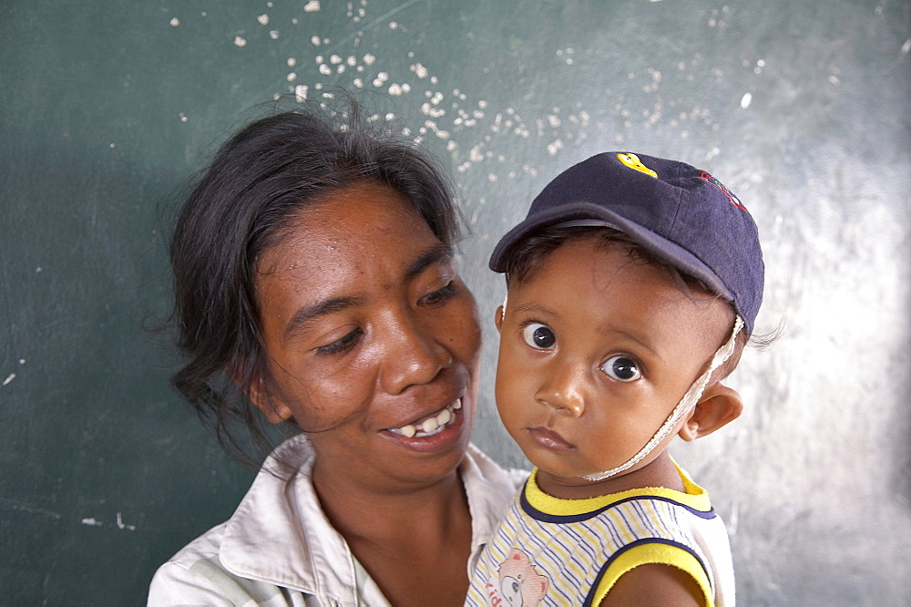 East timor. Camp for internally displaced people (idps) at the don bosco center in dili. Mother and child