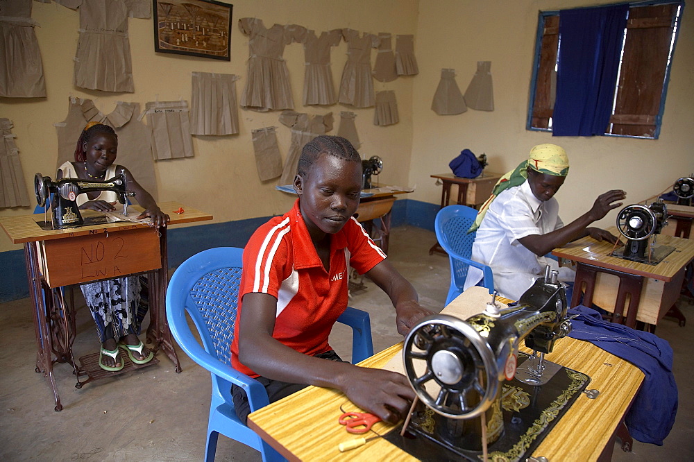 South sudan loka womens association. tailoring workshop. women using sewing machines