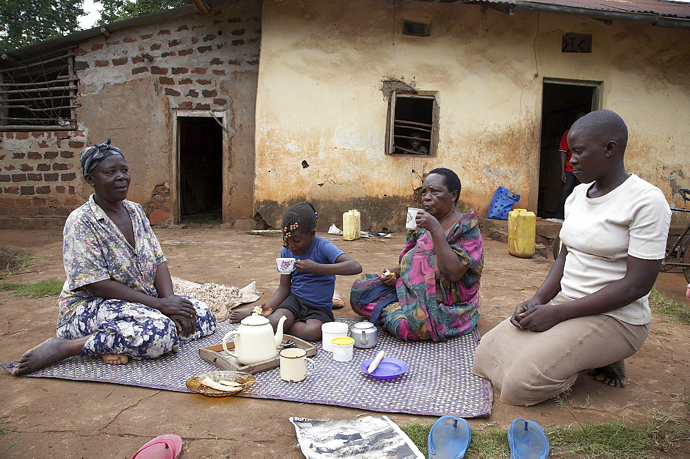 Uganda the home of ntanda miria, kayunga district. enjoying a relaxing breakfast outdoors