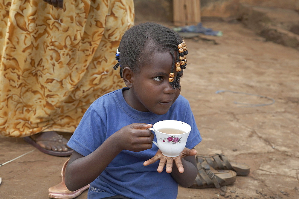 Uganda the home of ntanda miria, kayunga district. enjoying a relaxing breakfast outdoors