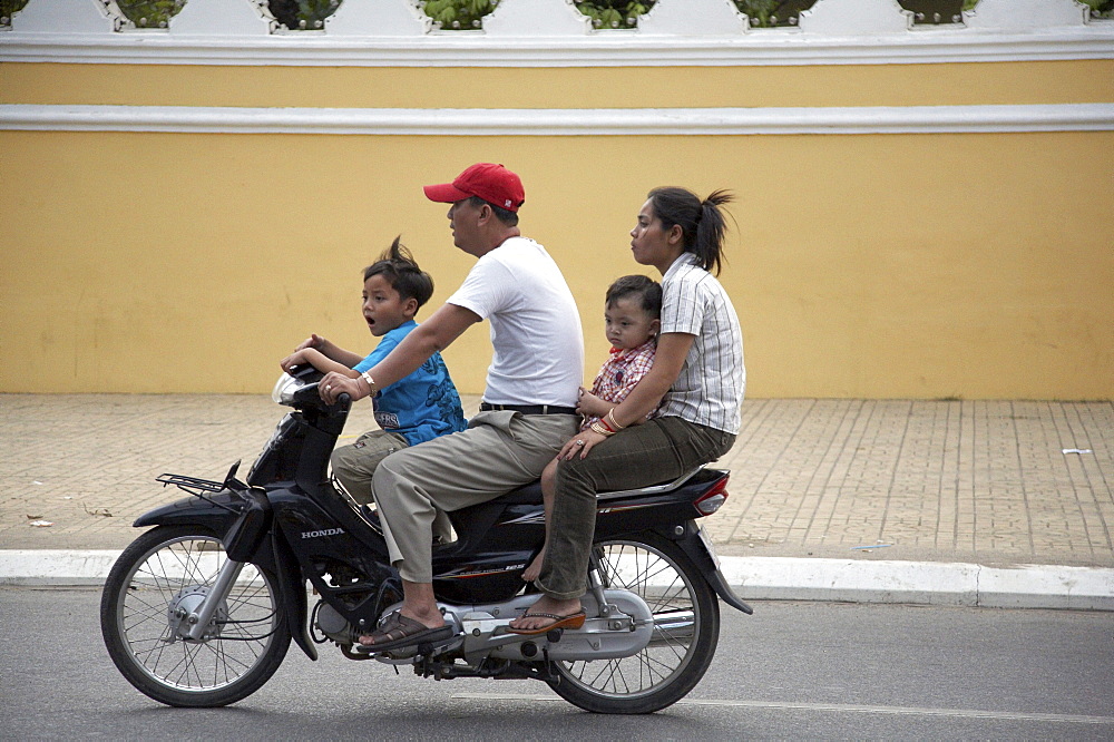 Cambodia family on motor cycle. phnom penh