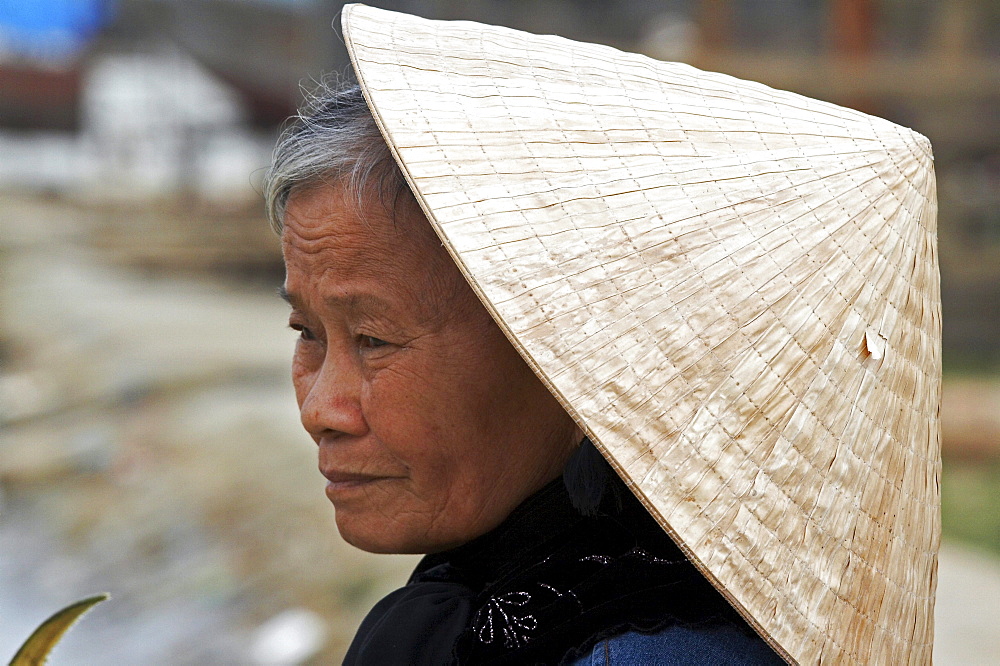 Vietnam woman wearing traditional hat, hoi an