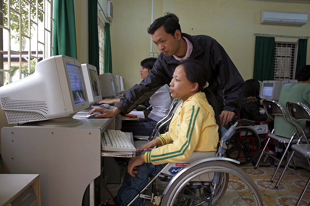 Vietnam crs (catholic relief service) work with people with disabilities extends into the college system with a project of inclusive education. at the hanoi college of it, shown here, there are 25 students with disabilities and 15 visually impaired. crs provides special mobility equipment such as wheelchair ramps, and with a joint grant shared by other funding agencies, provided an elevator at the college (seen here), so that wheelchair bound students could move easily to other floors of the building