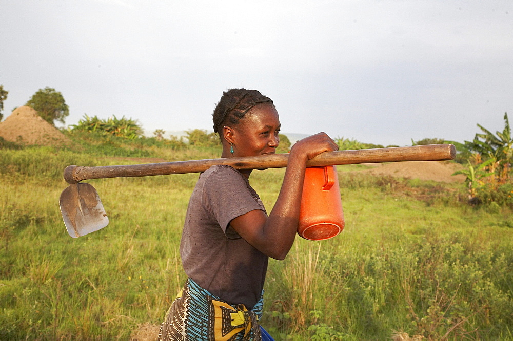 Tanzania woman carrying a hoe, kalabezo