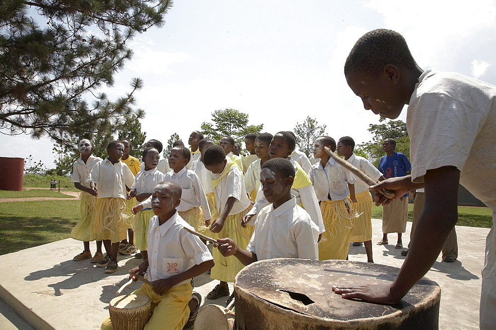 Tanzania school children dancing and playing drums on world aids day, kalabezo