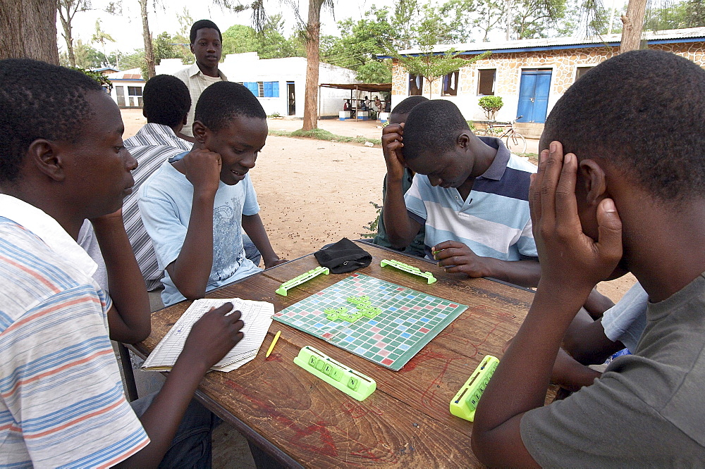 Tanzania boys playing scrabble, recreation center, musoma