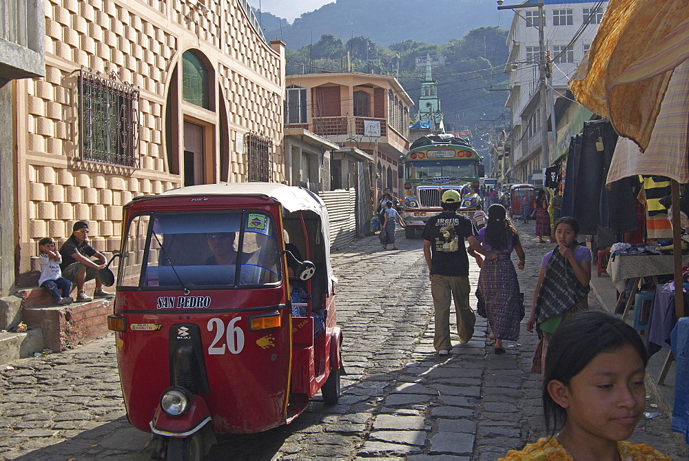 Guatemala san pedro la laguna, lake atitlan. Street with indiaan made bajaj tuk,tuk or auto,rickshaw.