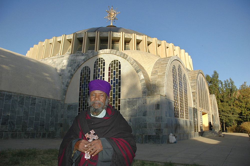 Religion, ethiopia. Kesegedez walde giogis, head priest of saint mary of zion churches. He is standing in front of the new church. Axum