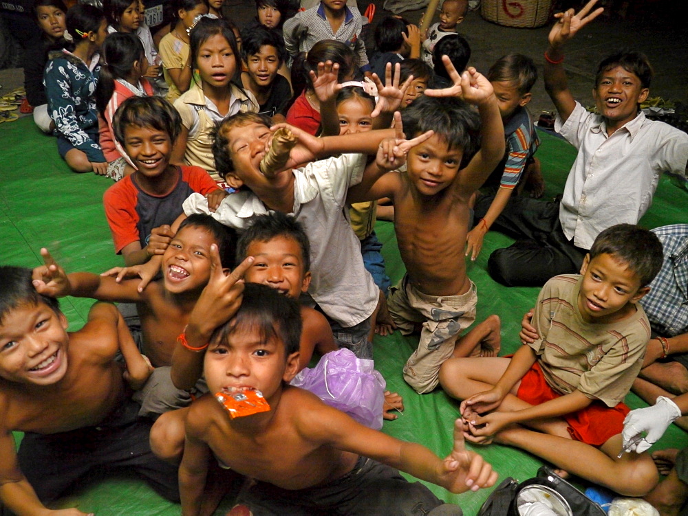 CAMBODIA Children receiving first aid by an outreach team of CSARO, central Phnom Penh