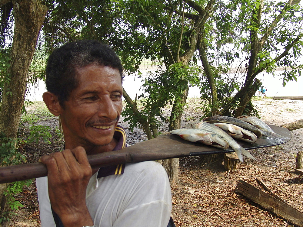 Colombia heny abufe, fisherman, with a small catch from the rio magdalena, barrancabermeja