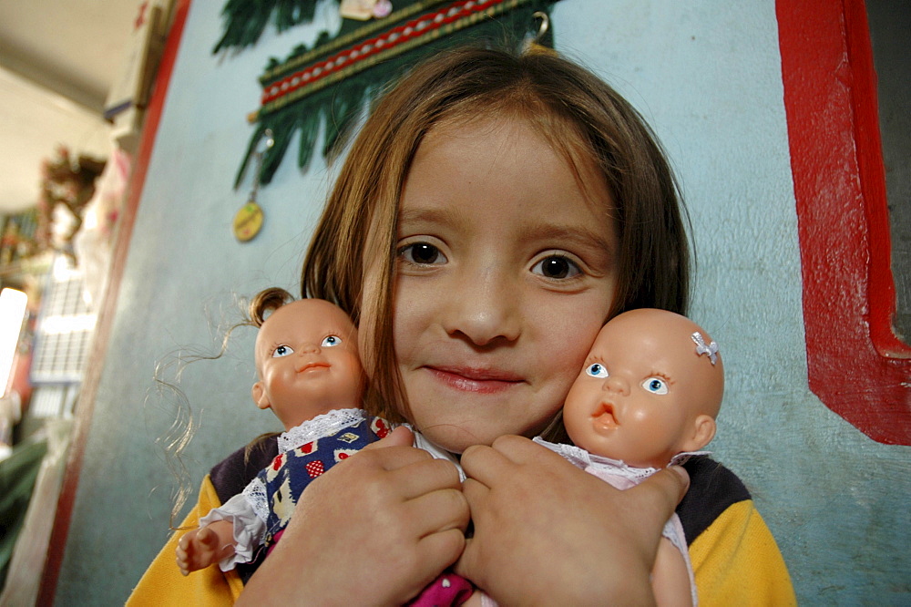 Colombia girl with her dolls. Altos de cazuca, bogota