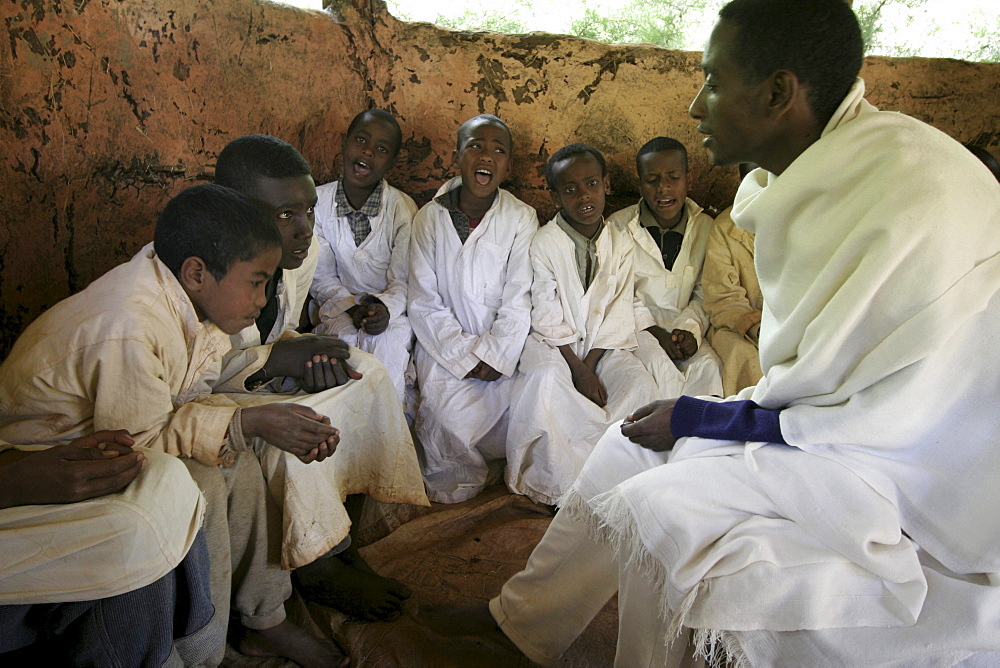 Ethiopia boys chanting geez prayers. Mihur eyesus orthodox monastery, gurage