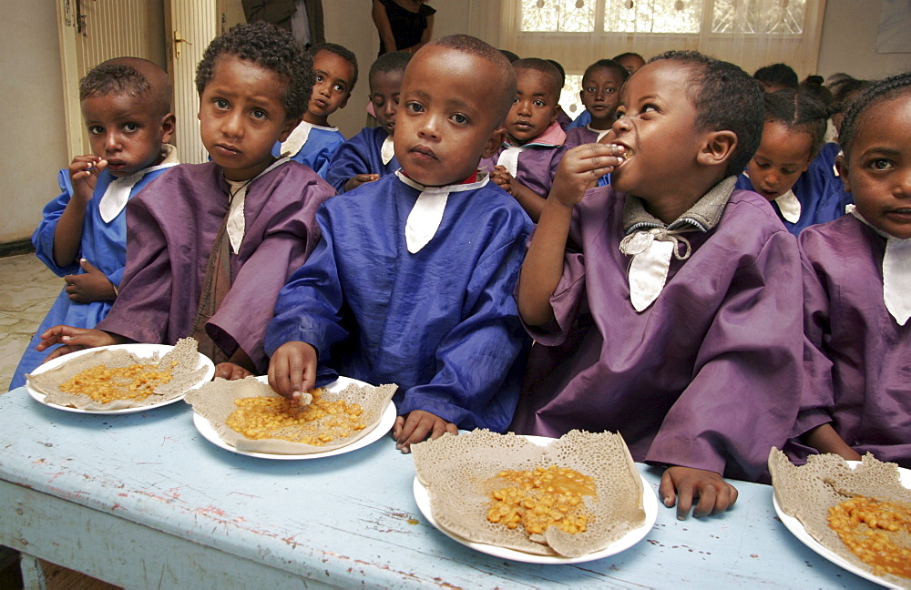 Ethiopia children eating lunch, shiro meda child care center of the addis hope project, addis ababa