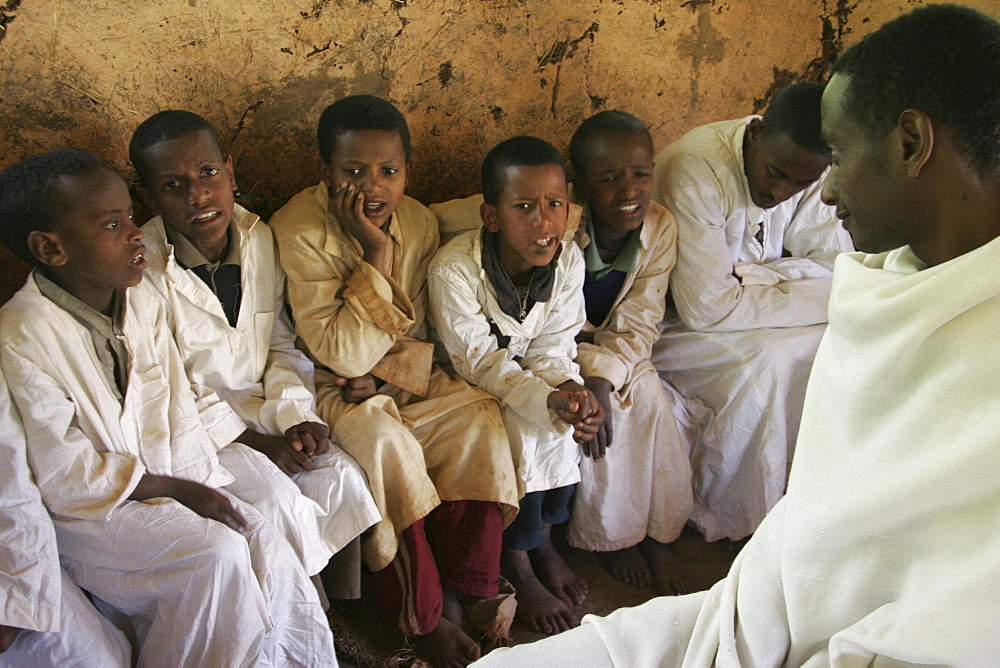 Ethiopia boys chanting geez prayers. Mihur eyesus orthodox monastery, gurage