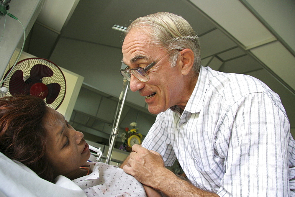 Thailand hiv+ patients in an aids hospice at a buddhist temple in lopburi, being cared for by father mike bassano, a maryknoll priest dedicating his life to serve the sick and needy