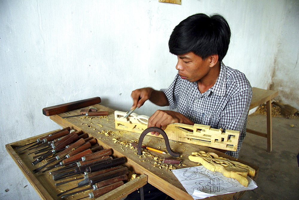 Vietnam apprentices learning woodcarving skills, nam dinh