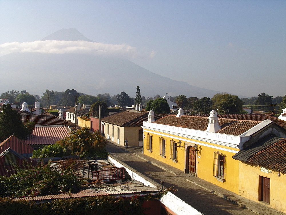 Guatemala street scene of antigua, with volcan de fuego in the background