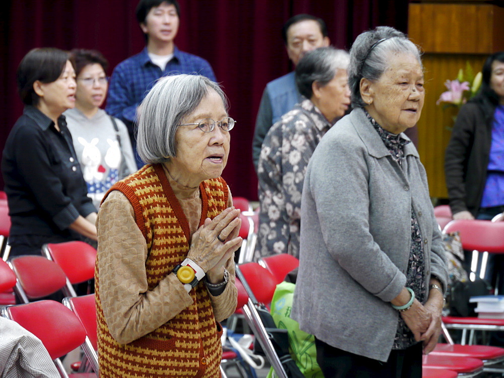 HONG KONG Mass at Christ the Worker Parish, Ngau Tau Kok, Kowloon. photo by Sean Sprague