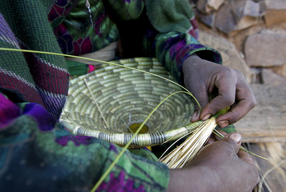 Women working at traditional basket. Most of the furniture in the houses are made out of natural element like sisal,wood or mud. Ethiopia