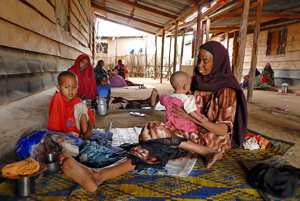 Kenya,dadaab refugees camp, somalian border gtz hospital ,the camps were set up around the town of dadaab beginning in 1991 when civil wars erupted on a grand scale in somalia (16 rival factions were involved). The wars, along with a prolonged drought, forced more than 900,000 somalis to flee to neighboring countries. Approximately 400,000 of them, many of whom were in a serious state of exhaustion and starvation, took refuge in kenya. Since then, a majority have returned to their country. However, some 131,000 somalis remain in kenya, and 110,000 are in dadaab, along with some sudanese, ugandans, and about 3,000 ethiopians women waiting the receive care from gtz ngo at the local hospital 