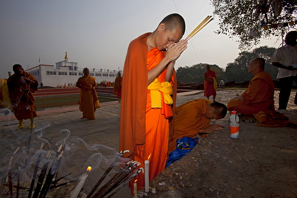 Buddhist pilgrims make incense offering to mayadevi temple. Lumbini, nepal