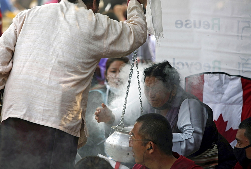 Pilgrims receive puriying essence blessings. Kalachakra initiation in bodhgaya, india  