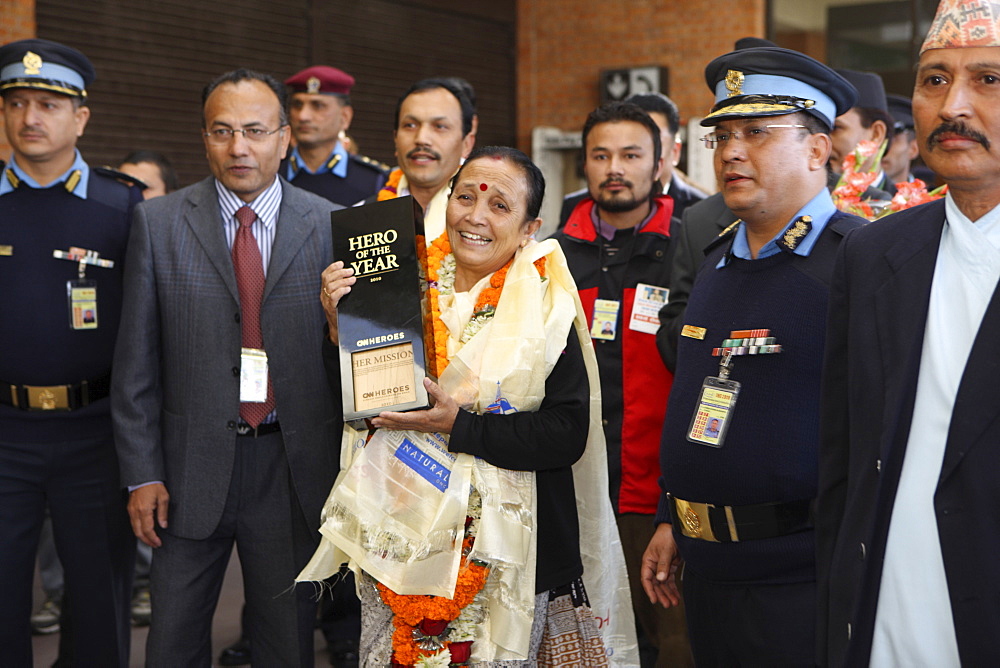 Anuradha Koirala holds up her CNN Hero of the Year 2010 award as she is warmly greeted upon her return. Tribhuwan International Airport, Kathmandu, Nepal. A woman whose group has rescued more than 12,000 women and girls from sex slavery has been named the 2010 CNN Hero of the Year. Anuradha Koirala was chosen by the public in an online poll that ran for eight weeks on CNN.com. ?Human trafficking is a crime, a heinous crime, a shame to humanity,? Koirala said after being introduced as one of the top 10 CNN Heroes of 2010. ?I ask everyone to join me to create a society free of trafficking. We need to do this for all our daughters