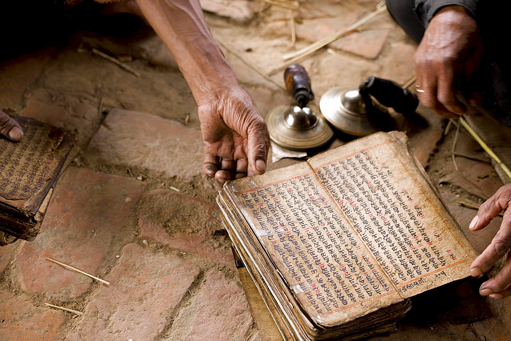 A Pilgrim reads his Hindu scripture. Bhaktapur, Nepal