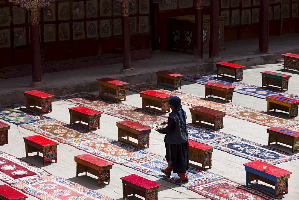 Tibetan interior: Tea tables and carpets arranged in the courtyard for a ceremony at Hemis Monastery. Ladakh, India