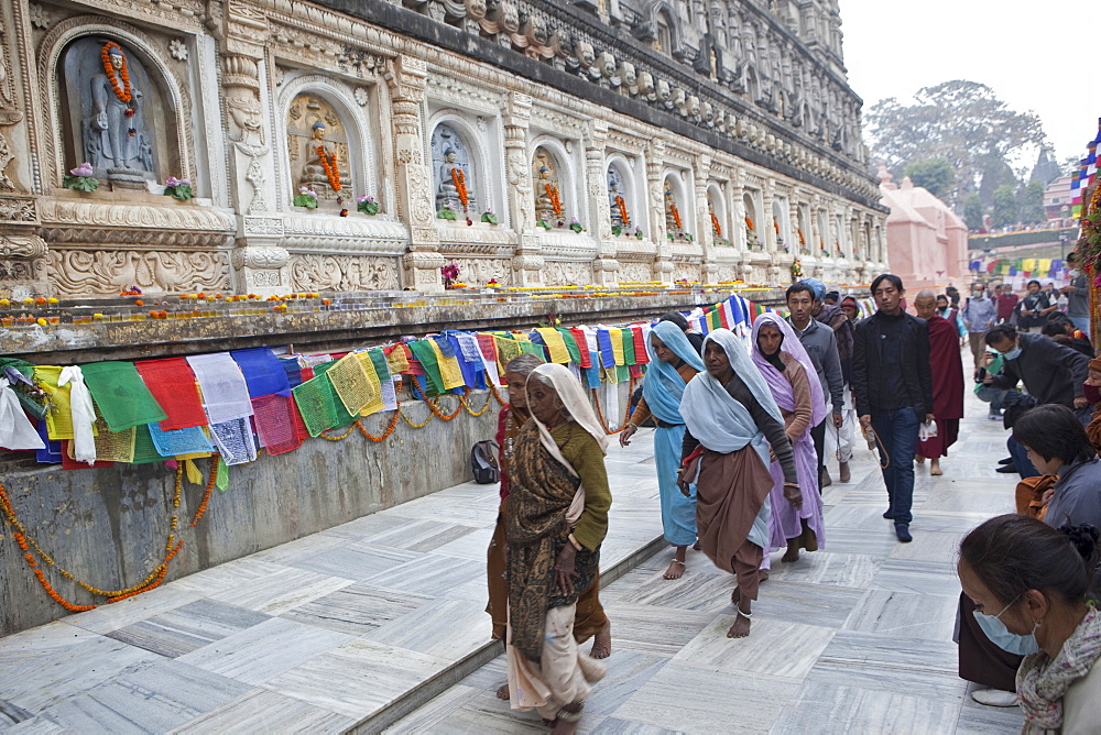 Hindu pilgrims come to maha bodhi temple to worship buddha because he is the reincarnation of vishnu. Maha bodhi temple complex. Kalachakra initiation in bodhgaya, india  