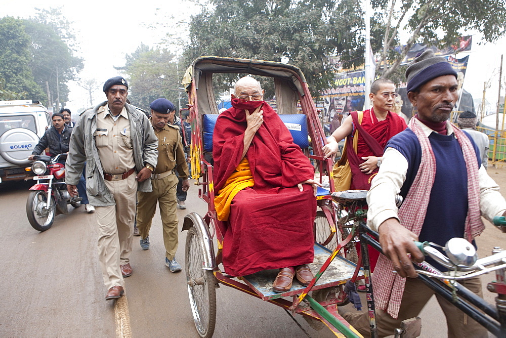 Tibetan monk take rickshaw to the main temple in bodhgaya. Kalachakra initiation in bodhgaya, bihar, india  