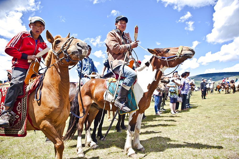 Horses and young horsemen on their mark for this years 20 kms bareback horse race during annual Naadam Festival, Bunkhan, Bulgam, Mongolia, Central Asia, Asia