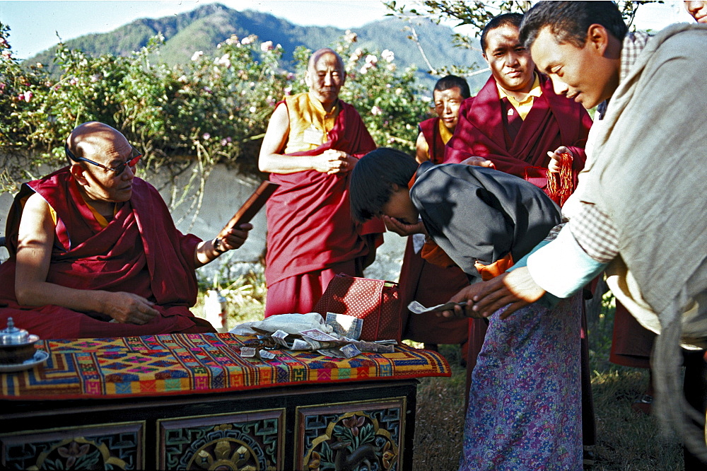 Trulshig rinpoche, blesses. Tulshig rinpoche blesses. Tulshig rimpoche s followers believe that he, like many other lamas, reassumes a human body after death in order to return to disciples. previous incarnation of tulshig rimpoche spent several years at dzarongpu monastery (highest monastery in world located at 16,500â€šÃ„Ã´ within sight of northern side of mt everest) served as of ngawong tenzin teachers. He promised to return in next life, so at tulshig s death ngawong tenzin norbu sought found reincarnation. current tulshig rimpoche then came to monastery studied with ngawong tenzin norbu. relationship between teacher student, in which a teacher returns to study from former student, maintains lineage over generations. Bhutan