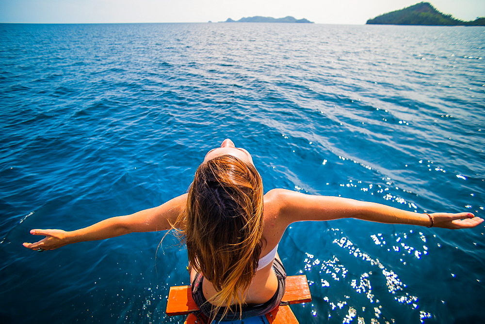 Girl on boat in Sumatra, Indonesia, Southeast Asia, Asia