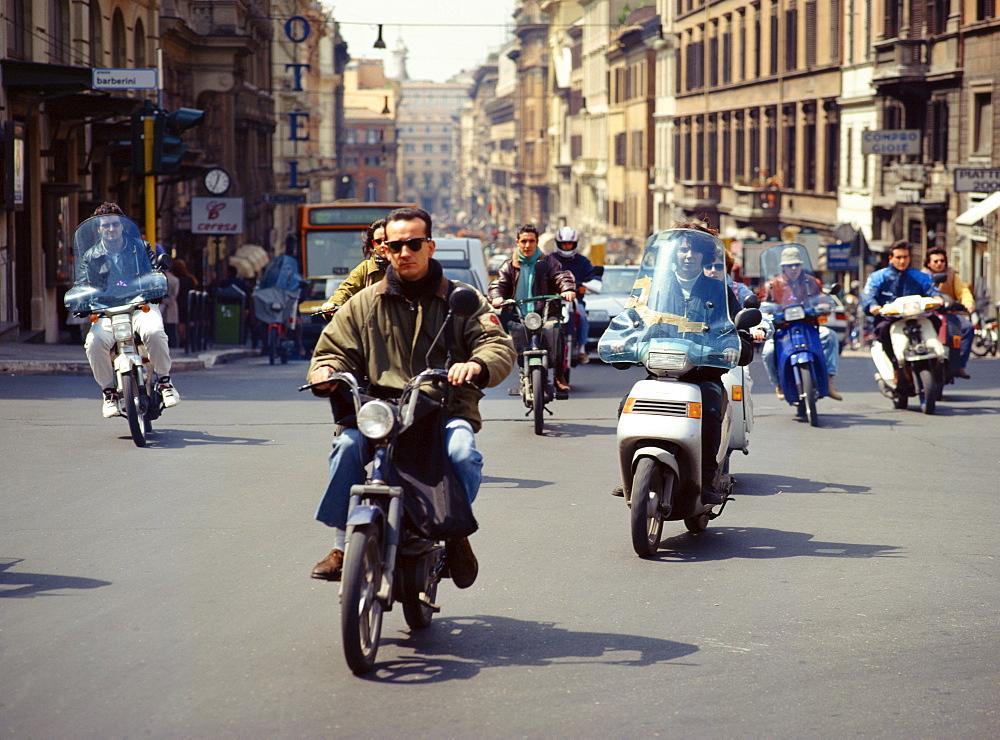 Motorbikes and scooters crossing the Piazza Barberini, Rome, Lazio, Italy, Europe