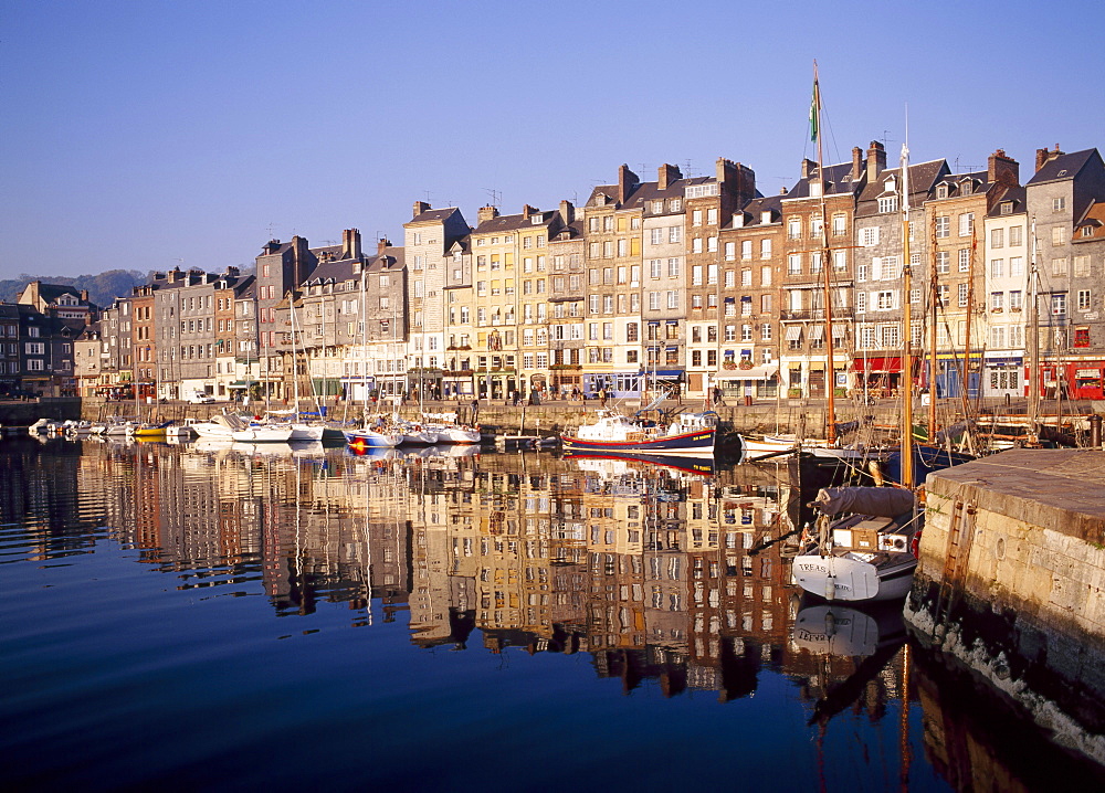 Reflections of houses and boats in the old harbour at St Catherine's Quay in Honfleur, Basse Normandy, France 