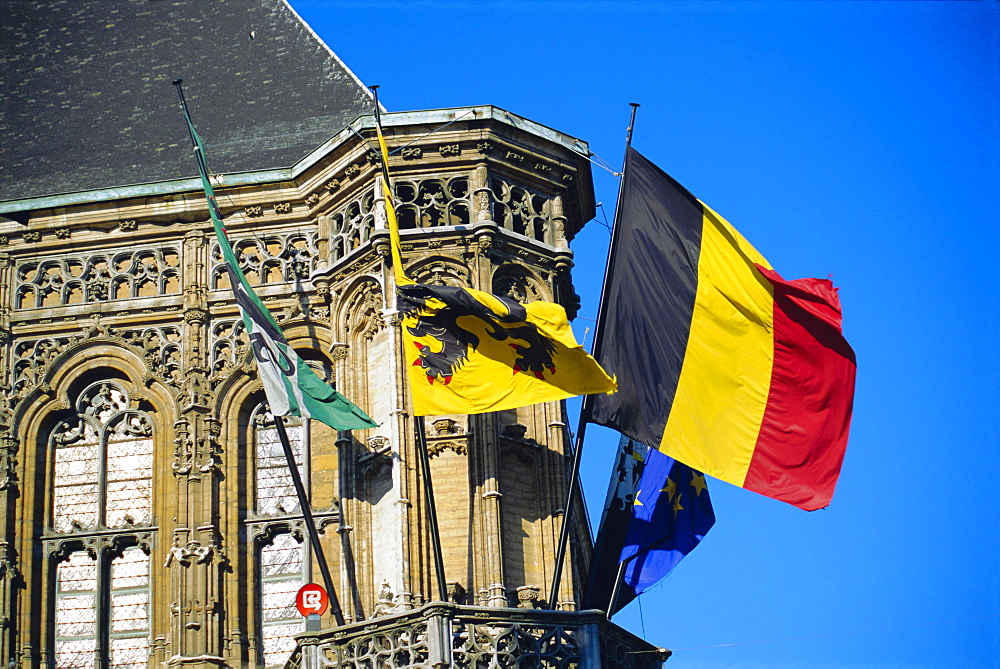 Flags of Belgium on the right, Flanders in the center on the town hall of Ghent, Flanders, Belgium