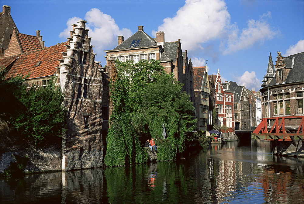 Gabled buildings with distorted facade of bricks, beside old canal, north of the centre of Ghent, Flanders, Belgium, Europe