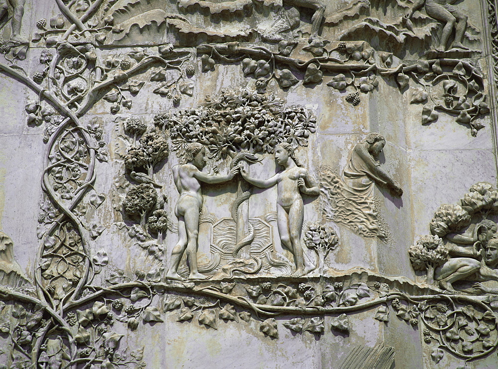 Detail showing Garden of Eden on 14th century marble relief by Lorenzo Maitani and pupiles, beside entrance to cathedral, Orvieto, Umbria, Italy, Europe