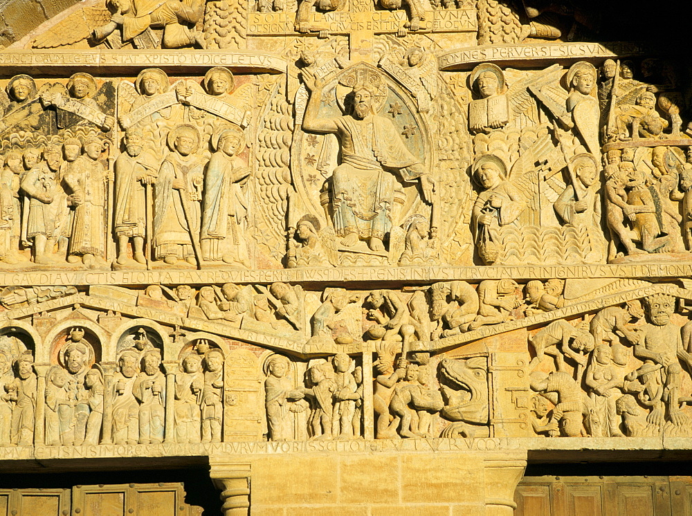 Tympanum above west door of abbey church of Ste. Foy (on the pilgrimage route to Santiago de Compostela) of Christ and the Last Judgement, UNESCO World Heritage Site, Conques, Midi-Pyrenees, France, Europe