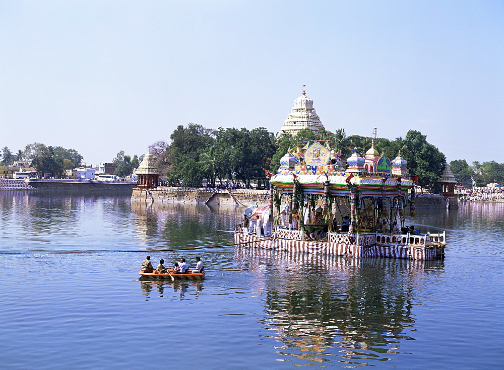 A barge carrying images of Shiva and Meenakshi being towed around the Vandiyur Mariamman Teppakulam tank at annual Floating Festival, Madurai, Tamil Nadu state, India, Asia