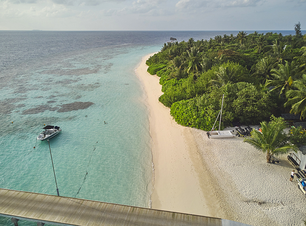 The shoreline and beach of a tropical paradise island in the Maldives: Havodda Island, Gaafu Dhaalu atoll, in the Maldives' far south, in the Indian Ocean.