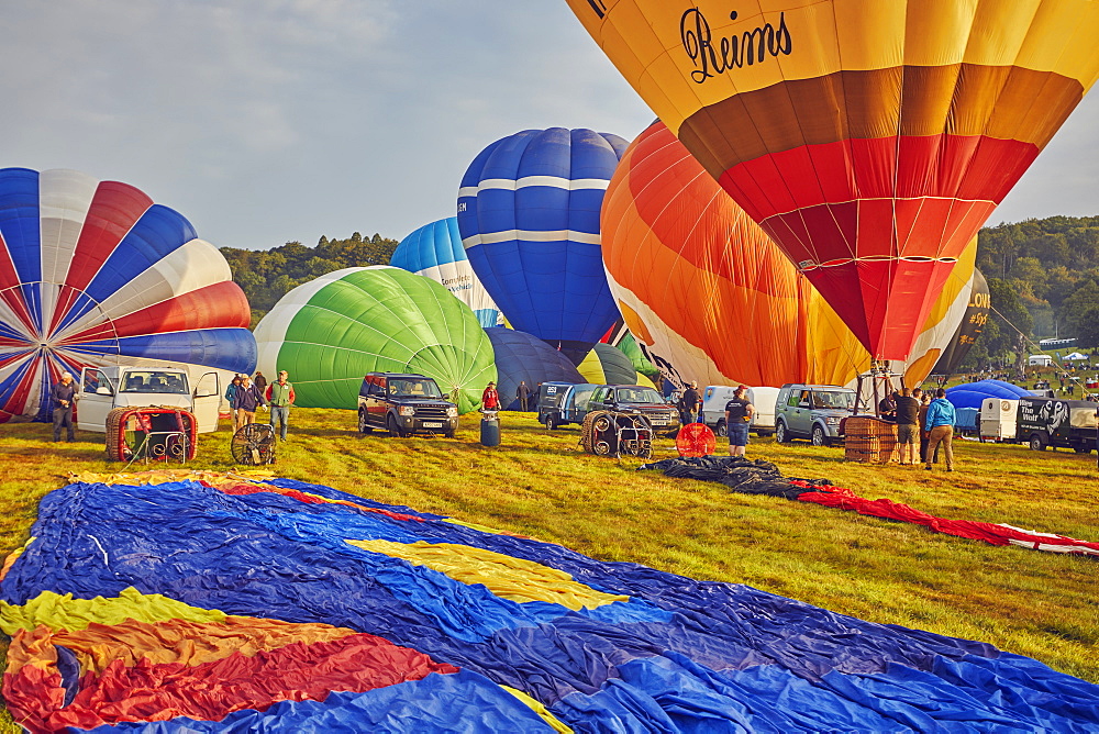 Hot-air balloons preparing to take off from the festival site during the annual Bristol International Balloon Fiesta, Bristol, England, United Kingdom, Europe