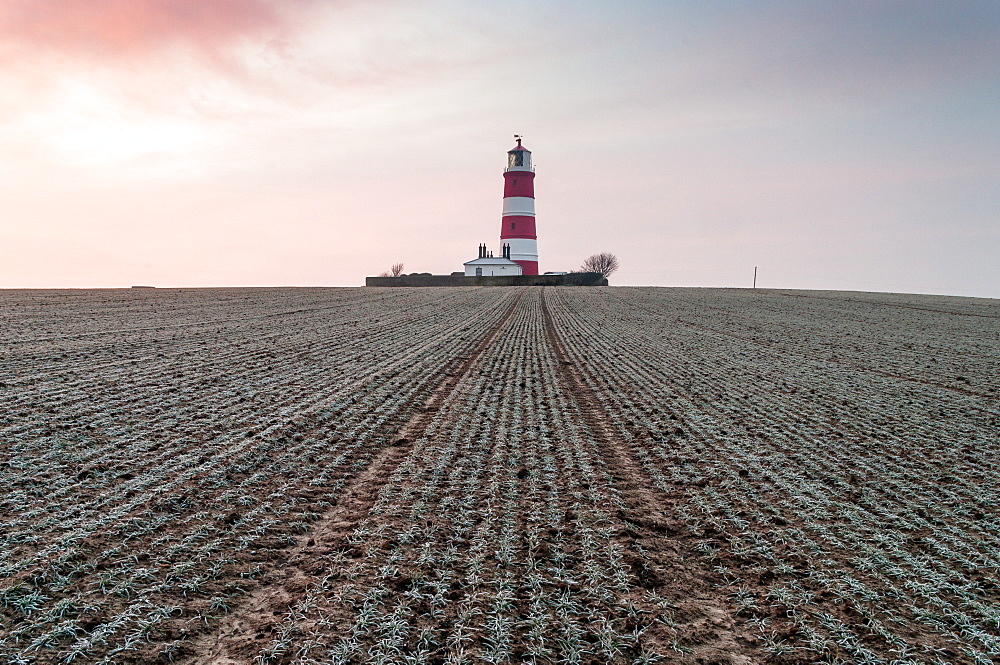 Sunrise at Happisburgh Lighthouse on a frosty morning, Happisburgh, Norfolk, England, United Kingdom, Europe