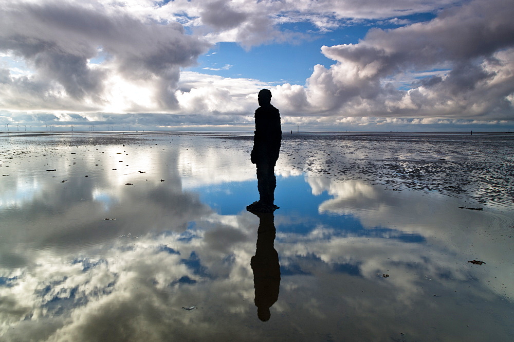 Statue by Antony Gormley, part of Another Place, Crosby Beach, Merseyside, England, United Kingdom, Europe