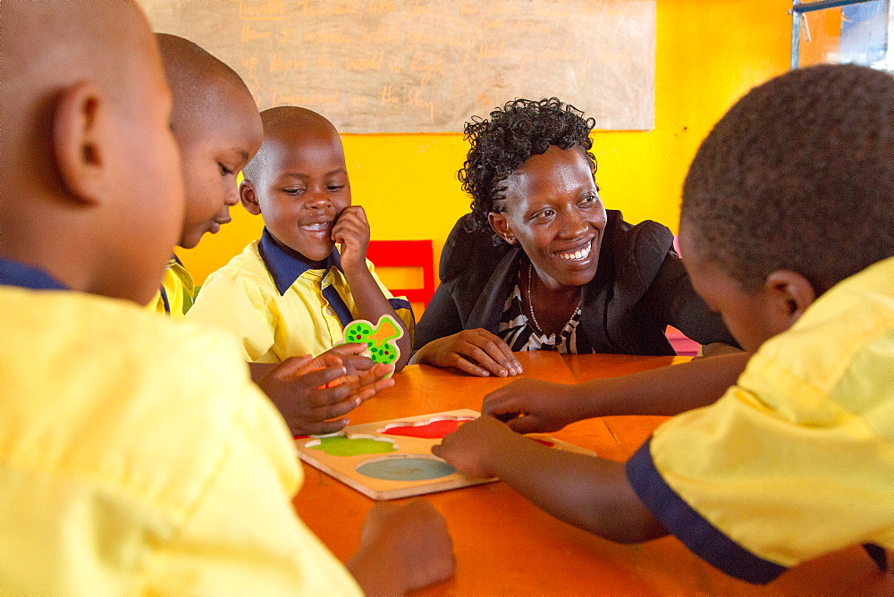 Agnes Mbvoyire, VSO national volunteer working alongside Filipino volunteer Rhea Villarico to improve standards of teaching in nursery schools in eastern Rwanda, Africa