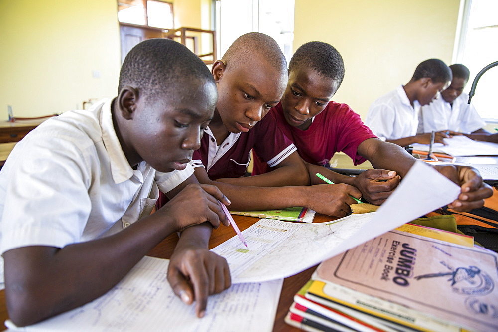 Children studying during a class taken by VSO volunteer Paul Jennings and local teacher Rebecca Ngovano, Angaza school, Lindi, Tanzania, East Africa, Africa