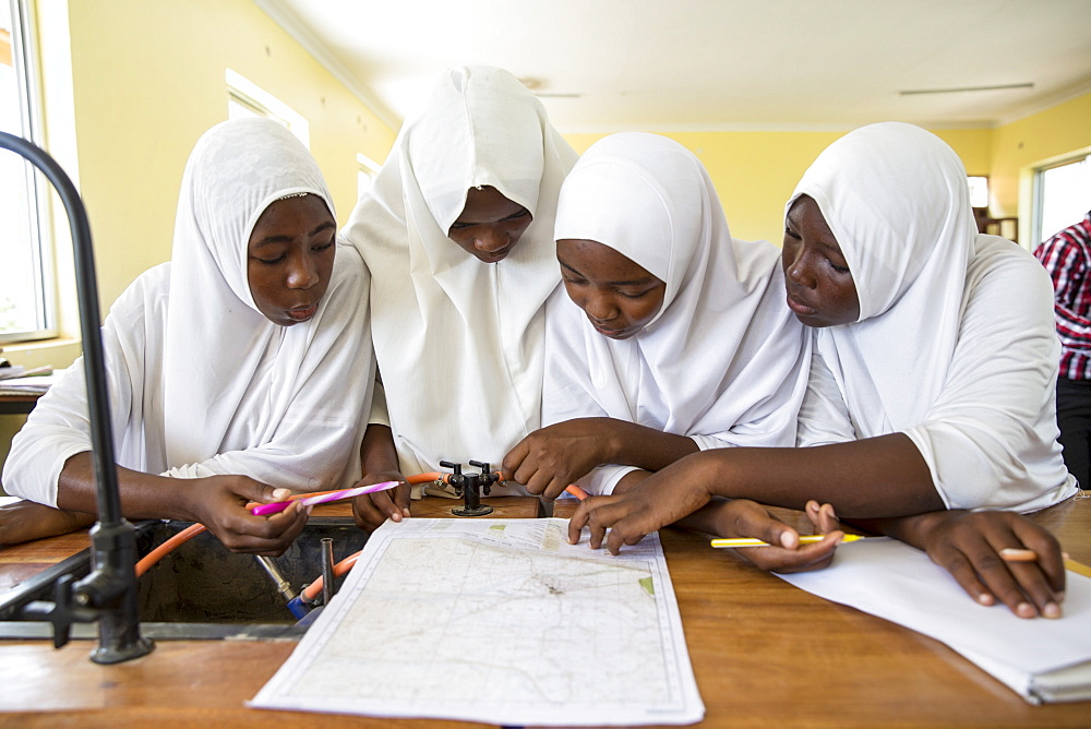 Children studying during a class taken by VSO volunteer Paul Jennings and local teacher Rebecca Ngovano, Angaza school, Lindi, Tanzania, East Africa, Africa